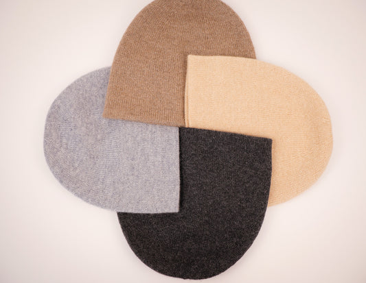 4 Modern Cashmere Beanies arranged in a circle pattern