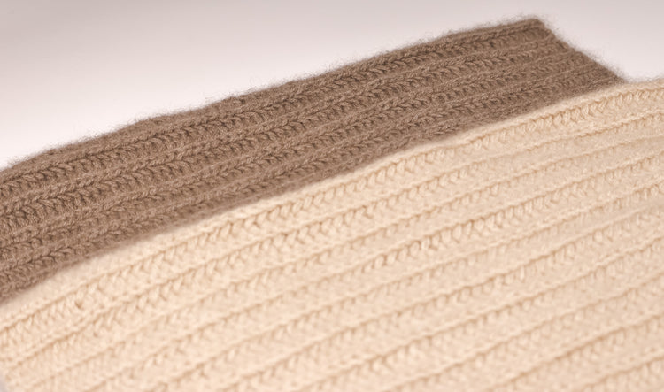 Zoomed in photo of the Taupe Brown and Oatmeal Beige Cashmere Infinity Scarves layered on top of each other. 