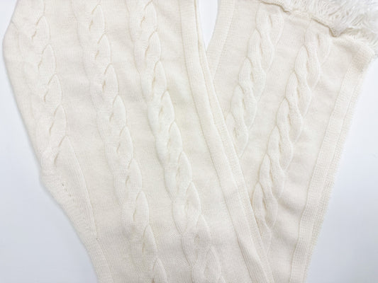 Zoomed in photo of the hooded cashmere shawl in a cross over style. 