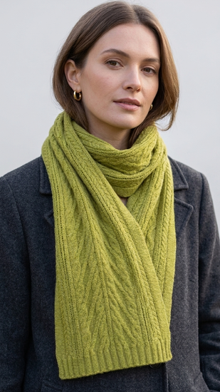 Model is wearing a pure cashmere scarf with patterned in moss green colour. 