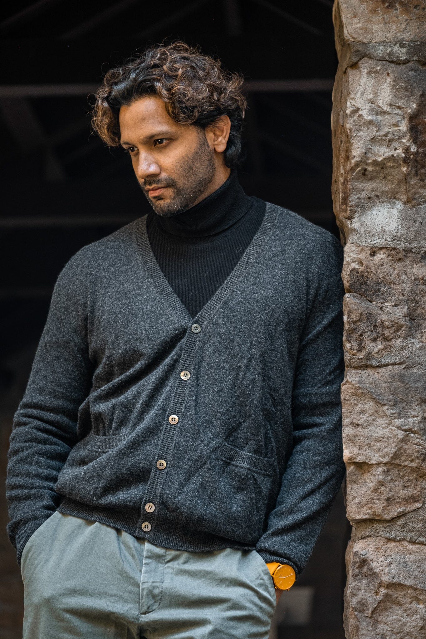 Model wearing the gray cashmere men's v-neck cardigan. 