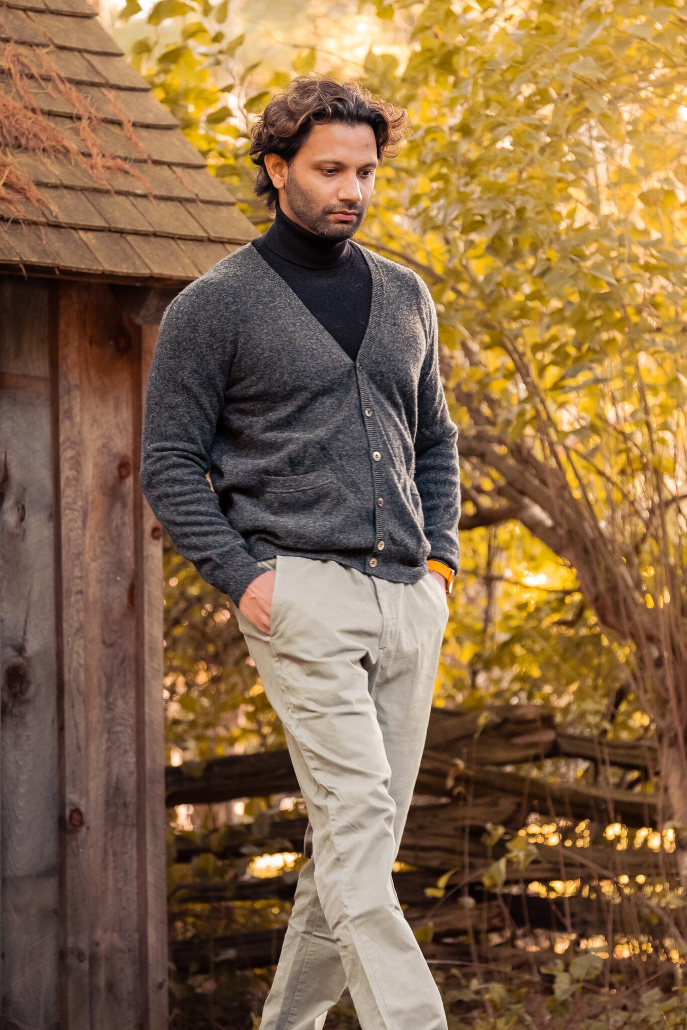 Model walking in the gray cashmere men's v-neck cardigan